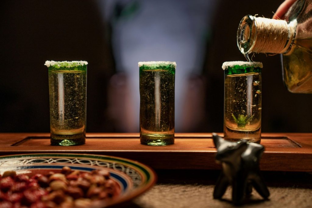 Premium additive-free tequila being poured into tasting glasses
