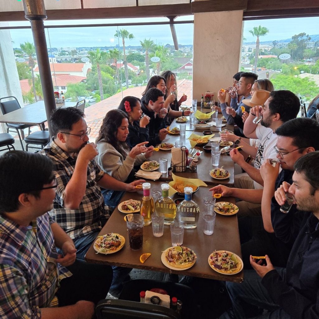 Large private group at a long table during a tequila tasting party in Old Town San Diego